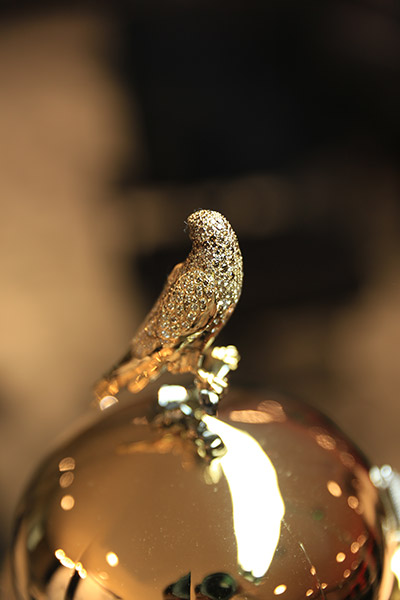 Most diamonds set on a perfume bottle bird