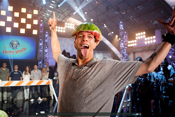 man with smashed watermelon on his head
