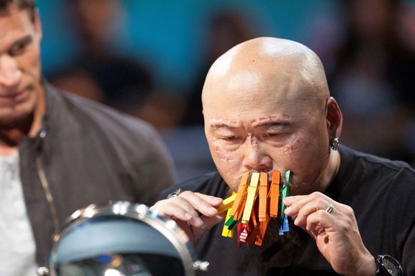 man with pegs on his mouth