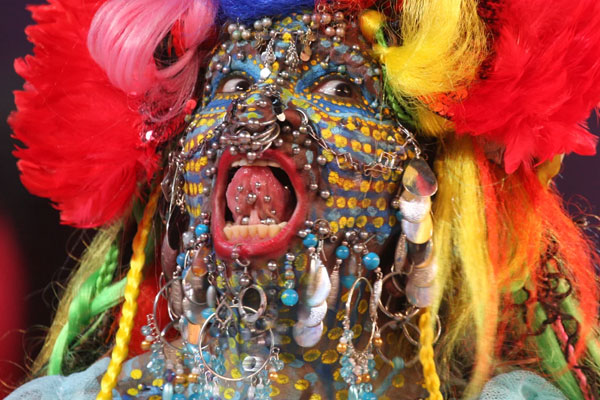 man with several piercings and body modifications