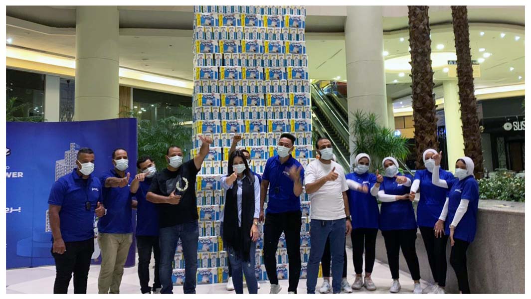 Hayat Egypt team celebrating the Tallest Packaged Product Tower