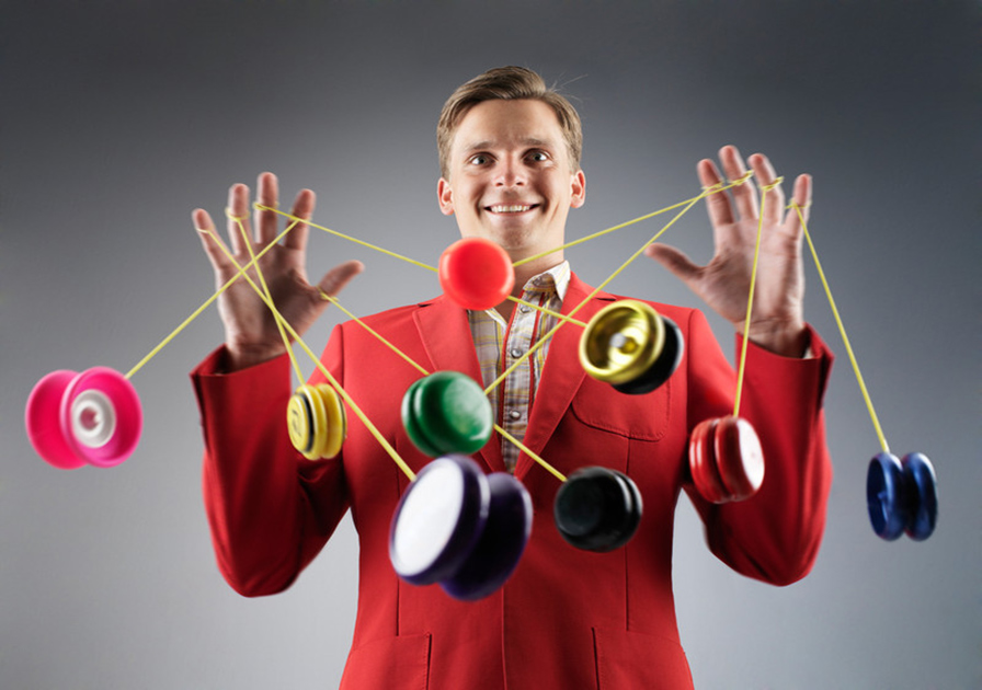 man with several yoyo's